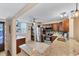 Modern kitchen with stainless steel appliances, granite countertops, and convenient washer/dryer in unit at 445 Palm Tree Dr, Bradenton, FL 34210