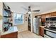 Efficient kitchen layout with stainless steel appliances, granite countertops, and convenient washer/dryer in unit at 445 Palm Tree Dr, Bradenton, FL 34210