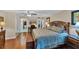 Spacious main bedroom features wood floors and an ensuite bathroom at 445 Palm Tree Dr, Bradenton, FL 34210