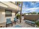 Private patio offers comfortable seating with a charming view of lush landscaping and a clear blue sky at 445 Palm Tree Dr, Bradenton, FL 34210