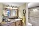 Updated bathroom with granite vanity, shower, and mirror at 5855 Midnight Pass Rd # 416, Sarasota, FL 34242
