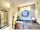 Updated bathroom with granite vanity, large mirror, and frameless shower at 5855 Midnight Pass Rd # 416, Sarasota, FL 34242