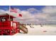 Scenic beach with lifeguard stand and clear blue waters at 5855 Midnight Pass Rd # 416, Sarasota, FL 34242