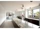Community kitchen and dining area with large windows at 5855 Midnight Pass Rd # 416, Sarasota, FL 34242