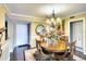 Formal dining room with a large table and chandelier at 5855 Midnight Pass Rd # 416, Sarasota, FL 34242