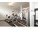 Fitness center with treadmills, stationary bike, and weight equipment at 5855 Midnight Pass Rd # 416, Sarasota, FL 34242
