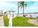 Peaceful waterfront gazebo with lounge chairs at 5855 Midnight Pass Rd # 416, Sarasota, FL 34242