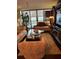 Bright living room featuring hardwood floors and ample natural light at 5855 Midnight Pass Rd # 416, Sarasota, FL 34242