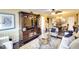 Open living and dining area with dark hardwood floors and stylish furnishings at 5855 Midnight Pass Rd # 416, Sarasota, FL 34242