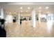 Bright and spacious lobby with tile floors and elevators at 5855 Midnight Pass Rd # 416, Sarasota, FL 34242
