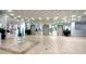 Bright lobby with elevators and tiled floors at 5855 Midnight Pass Rd # 416, Sarasota, FL 34242