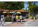 Bustling street scene with pedestrians and restaurants at 5855 Midnight Pass Rd # 416, Sarasota, FL 34242