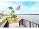 Steps leading to a waterfront view and patio area at 5855 Midnight Pass Rd # 416, Sarasota, FL 34242