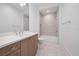 Clean bathroom with a shower/tub combo, modern vanity, and neutral tile at 3739 Caledonia Ln, Sarasota, FL 34240