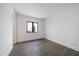 Simple bedroom with hardwood floors and a window at 3739 Caledonia Ln, Sarasota, FL 34240