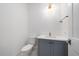 Stylish powder room with gray vanity and patterned floor at 3739 Caledonia Ln, Sarasota, FL 34240