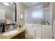 Bathroom includes a walk-in tub and updated vanity at 620 Burke Rd, Venice, FL 34293