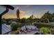 Stunning sunset view over canal, with private patio and pool area at 6934 Belgrave Dr, Siesta Key, FL 34242