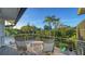 Private balcony with canal views and comfortable seating at 6934 Belgrave Dr, Siesta Key, FL 34242