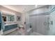 Modern bathroom with a glass shower, floating vanity, and elegant tilework at 6934 Belgrave Dr, Siesta Key, FL 34242