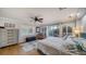 Comfortable bedroom with a queen-size bed, hardwood floors and sliding doors to balcony at 6934 Belgrave Dr, Siesta Key, FL 34242