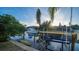 Private boat dock with lift and kayak, offering convenient water access at 6934 Belgrave Dr, Siesta Key, FL 34242