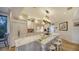 Gourmet kitchen with expansive island, marble countertops, and custom cabinetry at 6934 Belgrave Dr, Siesta Key, FL 34242