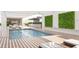 Relaxing rooftop pool with lounge chairs and lush greenery at 1305 4Th St # 501D, Sarasota, FL 34236