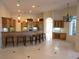 Bright kitchen featuring ample cabinetry and a large island with seating at 7009 Stanhope Pl, University Park, FL 34201