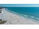 Wide beach view, with white sand and blue ocean at 1660 Summerhouse Ln # 102, Sarasota, FL 34242