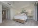 Comfortable bedroom with access to a full bathroom and hallway at 1660 Summerhouse Ln # 102, Sarasota, FL 34242