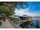 Private boat dock with multiple slips for various sized boats at 1660 Summerhouse Ln # 102, Sarasota, FL 34242