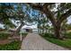Pathway to a private boat dock nestled under mature oak trees at 1660 Summerhouse Ln # 102, Sarasota, FL 34242