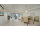 Open concept dining area with neutral tones and natural light at 1660 Summerhouse Ln # 102, Sarasota, FL 34242