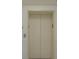 Modern elevator with neutral-colored walls and doors at 1660 Summerhouse Ln # 102, Sarasota, FL 34242