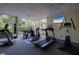 Modern fitness center featuring treadmills and ellipticals at 1660 Summerhouse Ln # 102, Sarasota, FL 34242