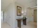 Bright hallway with tile floors and simple decor at 1660 Summerhouse Ln # 102, Sarasota, FL 34242