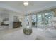 Living area with access to a balcony and bedroom view at 1660 Summerhouse Ln # 102, Sarasota, FL 34242