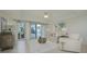 Spacious living room with water views and comfy furniture at 1660 Summerhouse Ln # 102, Sarasota, FL 34242