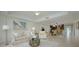 Bright living room with access to balcony and kitchen at 1660 Summerhouse Ln # 102, Sarasota, FL 34242