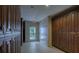 Locker room with wood cabinets and plenty of space at 1660 Summerhouse Ln # 102, Sarasota, FL 34242