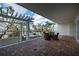 Spacious patio with pergola offering scenic water views at 1660 Summerhouse Ln # 102, Sarasota, FL 34242