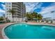 Relaxing resort-style pool with plenty of lounge chairs at 1660 Summerhouse Ln # 102, Sarasota, FL 34242