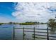 Scenic waterfront view with a calm waterway and distant homes at 1660 Summerhouse Ln # 102, Sarasota, FL 34242