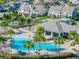 Aerial view of community pool and clubhouse with surrounding palm trees at 11926 Seabrook Ave, Lakewood Ranch, FL 34211