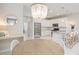 Kitchen with white cabinets, stainless steel appliances, and a round dining table at 11926 Seabrook Ave, Lakewood Ranch, FL 34211