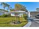 Single-story home with carport and well-manicured lawn at 1832 University Pl # 23, Sarasota, FL 34235