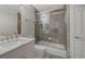Modern bathroom with a soaking tub and walk-in shower at 611 Riviera Dunes Way # 702, Palmetto, FL 34221