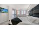 Spacious bedroom with water views and a large bed at 611 Riviera Dunes Way # 702, Palmetto, FL 34221