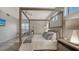 Main bedroom with a canopy bed and city views at 611 Riviera Dunes Way # 702, Palmetto, FL 34221